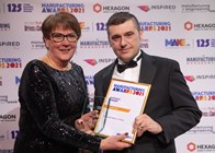 Craig Dixon collects the award on behalf of Peacocks Medical Group for National H&S Winners